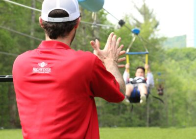 HighFlyer Zipline staff member cheering riders in flight at Foxwoods Resort Casino, Connecticut