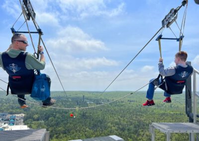 Father and son taking off together on HighFlyer Zipline at Foxwoods Resort Casino, Connecticut