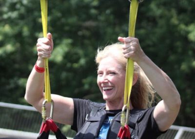 Smiling rider after landing on HighFlyer Zipline at Foxwoods Resort Casino, Connecticut