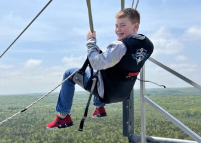 Young boy taking off on HighFlyer Zipline at Foxwoods Resort Casino, Connecticut