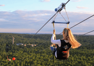 Woman flying solo on HighFlyer Zipline at Foxwoods Resort Casino, Connecticut