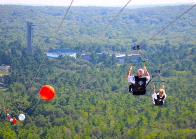 Older rider enjoying HighFlyer Zipline at Foxwoods Resort Casino, Connecticut