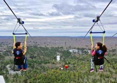 Kids flying on HighFlyer Zipline at Foxwoods Resort Casino, Connecticut